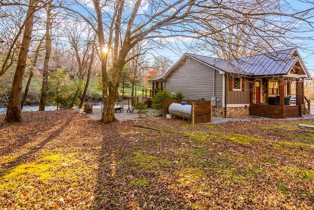 view of home's exterior with board and batten siding and metal roof