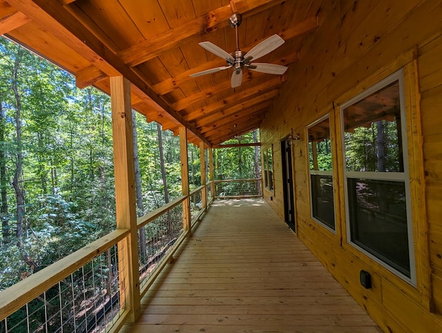 wooden terrace featuring ceiling fan