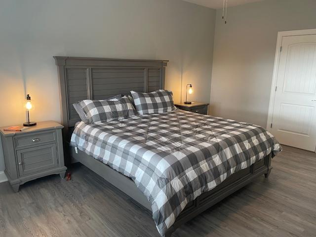 bedroom featuring dark hardwood / wood-style floors