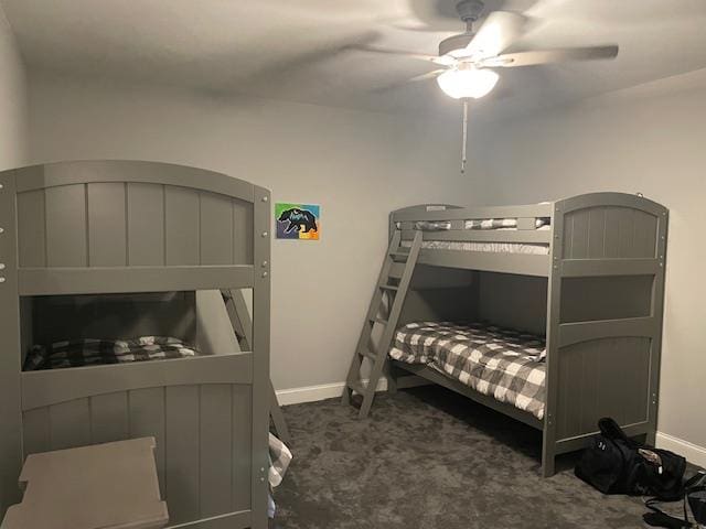 bedroom featuring ceiling fan and dark carpet