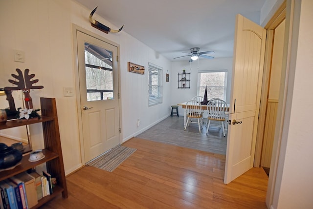 entrance foyer featuring light hardwood / wood-style flooring and ceiling fan