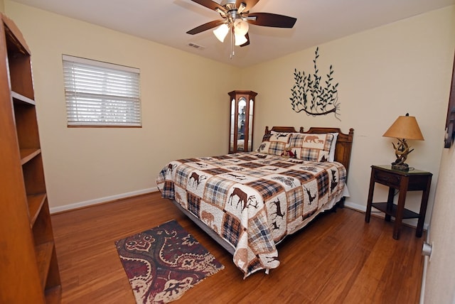 bedroom featuring ceiling fan and wood-type flooring