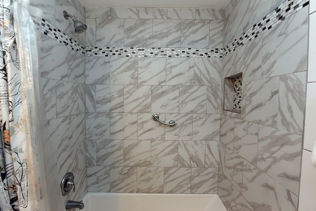 bathroom featuring shower / bath combo with shower curtain