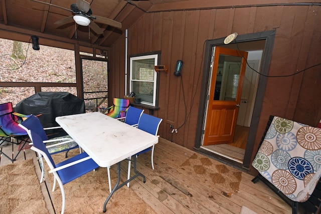 sunroom featuring ceiling fan