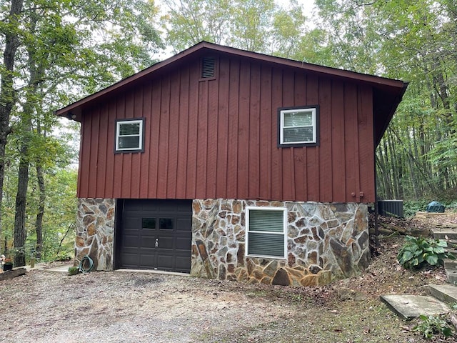 view of side of property featuring a garage