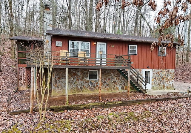 back of house featuring a deck