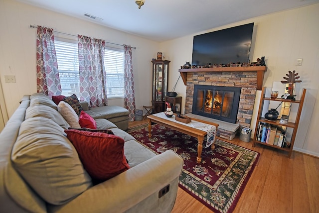 living room featuring a fireplace and hardwood / wood-style floors