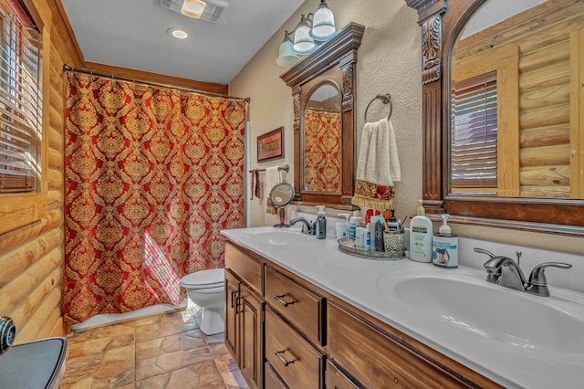 32 Mountain Meadows Dr, Hayesville, NC 28904 - full bathroom with stone finish floors, toilet, double vanity, a shower with curtain, and rustic walls