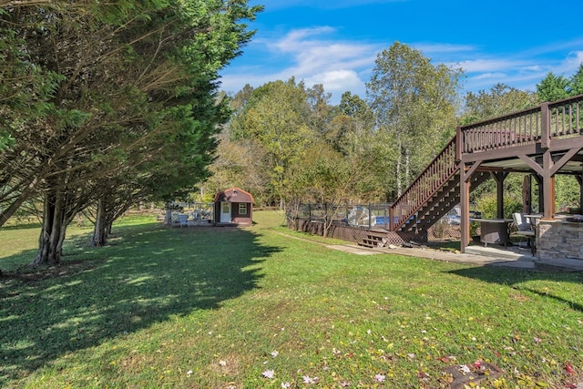 32 Mountain Meadows Dr, Hayesville, NC 28904 - view of green lawn with an outbuilding, stairs, a deck, and a shed