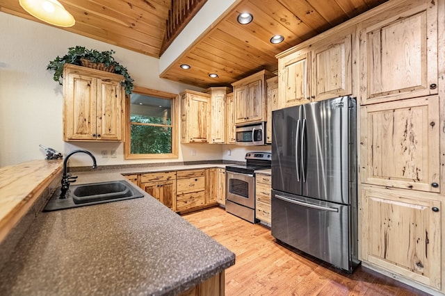 kitchen featuring wood ceiling, appliances with stainless steel finishes, a sink, and light brown cabinetry