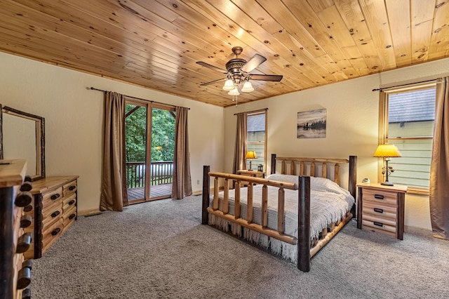 carpeted bedroom with access to exterior, wood ceiling, a ceiling fan, and a textured wall