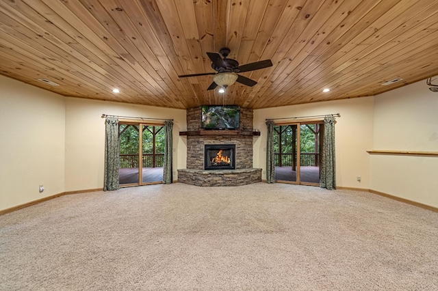 unfurnished living room with a wealth of natural light, carpet flooring, and recessed lighting