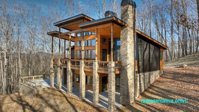 view of side of home with a patio