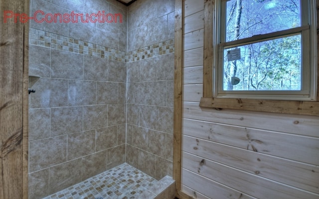 full bath featuring tiled shower