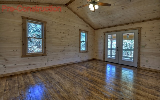 empty room featuring visible vents, vaulted ceiling, french doors, a ceiling fan, and wood-type flooring