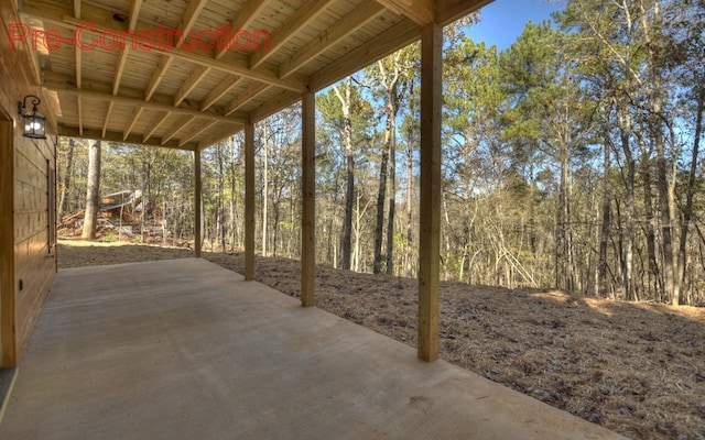 view of patio with a forest view