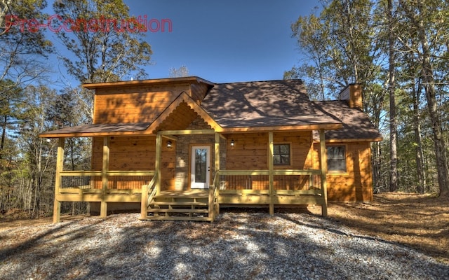 chalet / cabin featuring a chimney