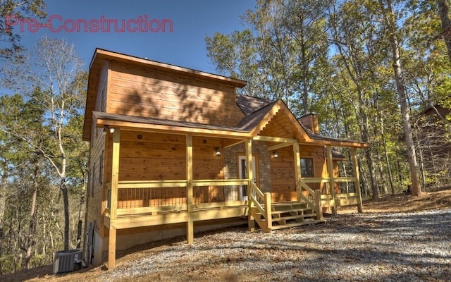 view of front of house with central air condition unit, covered porch, and a chimney