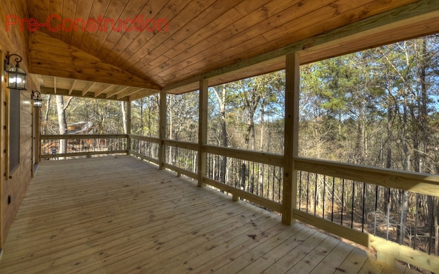 unfurnished sunroom with lofted ceiling and wood ceiling