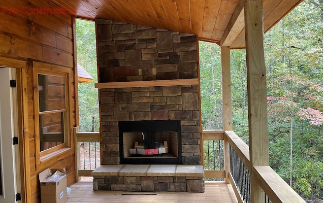 exterior space with an outdoor stone fireplace