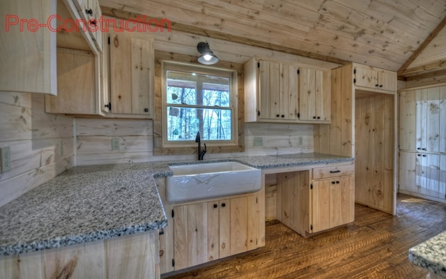 kitchen with a sink, light brown cabinets, lofted ceiling, wooden ceiling, and dark wood-style flooring