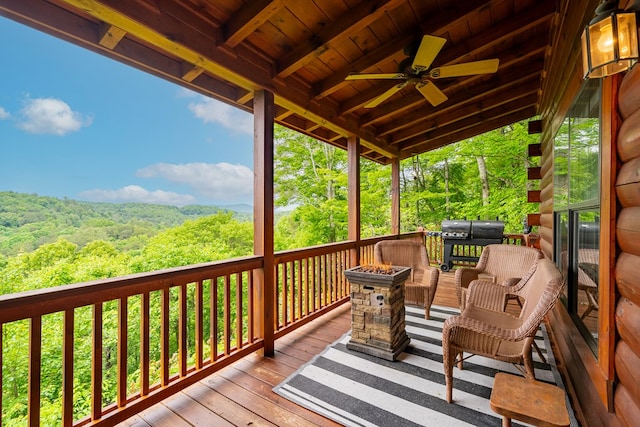 deck featuring grilling area and ceiling fan