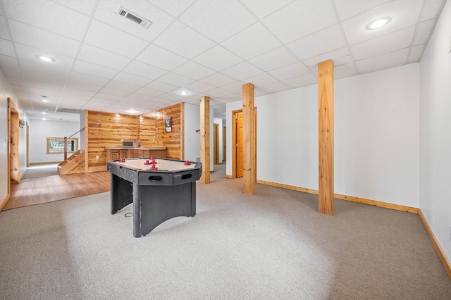 rec room featuring a drop ceiling and carpet floors