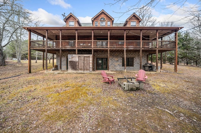 back of house featuring a deck