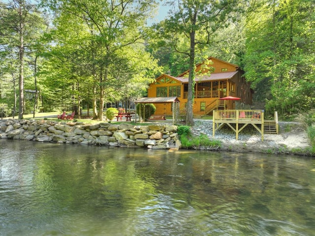 exterior space featuring a wooded view