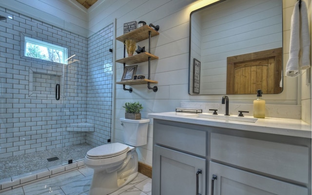 bathroom featuring vanity, toilet, and walk in shower