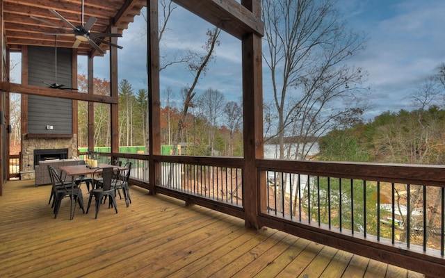 wooden terrace featuring ceiling fan