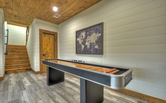 playroom featuring wooden ceiling, wood-type flooring, and wood walls