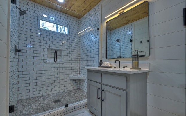 bathroom with wooden ceiling, vanity, and an enclosed shower