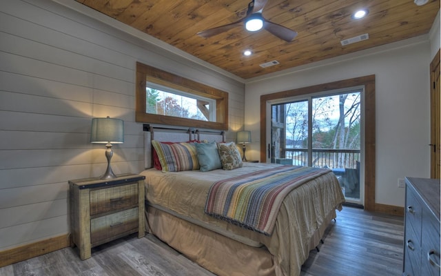 bedroom with dark wood-type flooring, ceiling fan, ornamental molding, and access to exterior