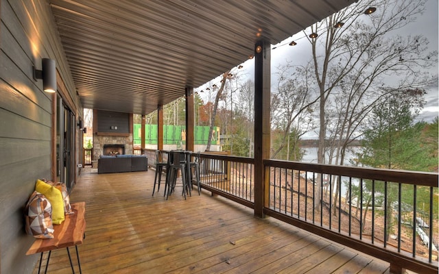 wooden deck featuring a water view