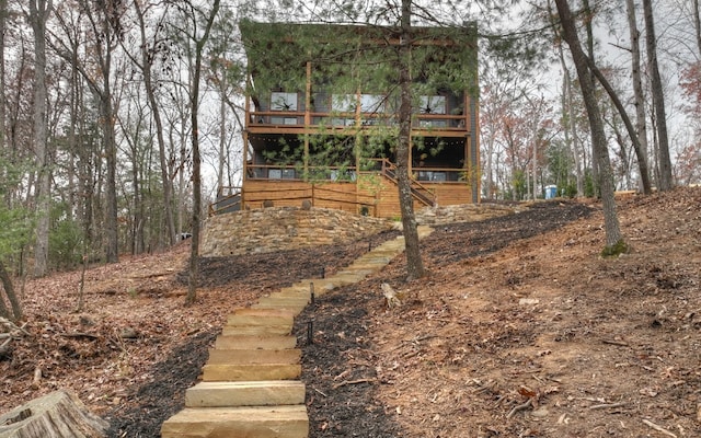 back of property with a balcony