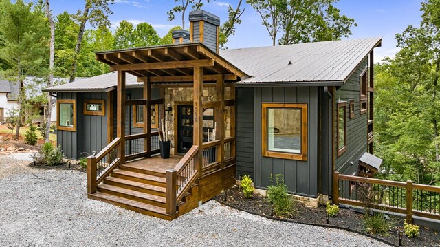 rear view of property with a porch