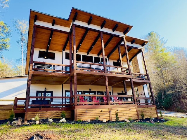 rear view of property with a deck