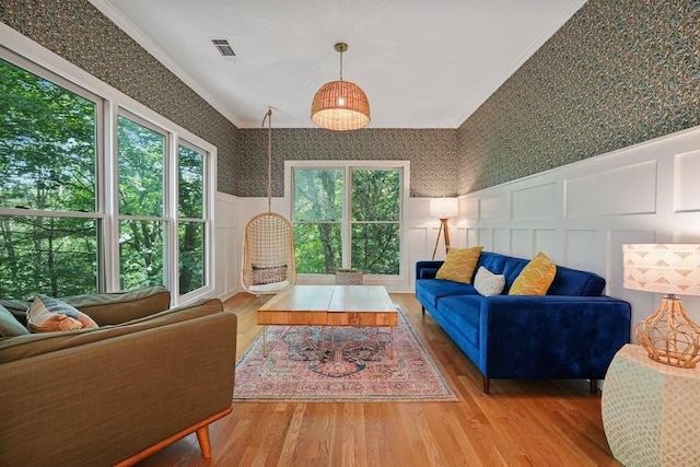 159 Cinnamon Fern Ln, Big Canoe, GA 30143 - living area with wallpapered walls, a decorative wall, crown molding, wood finished floors, and a wainscoted wall