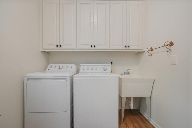159 Cinnamon Fern Ln, Big Canoe, GA 30143 - washroom featuring cabinet space, washing machine and clothes dryer, wood finished floors, and baseboards