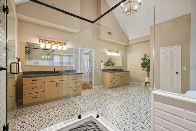 159 Cinnamon Fern Ln, Big Canoe, GA 30143 - full bathroom featuring high vaulted ceiling, two vanities, a shower stall, tile patterned floors, and baseboards