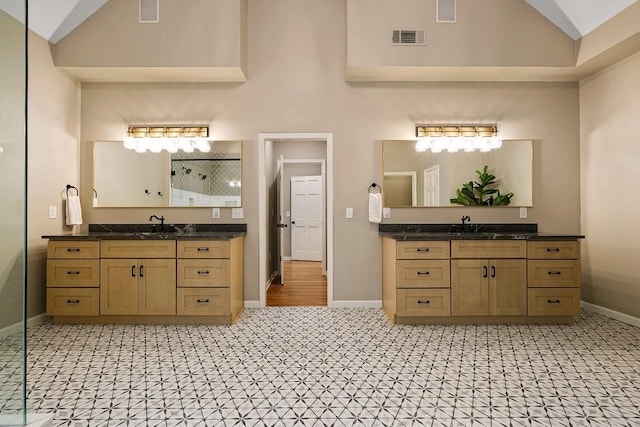 159 Cinnamon Fern Ln, Big Canoe, GA 30143 - full bathroom featuring baseboards, a stall shower, high vaulted ceiling, and two vanities