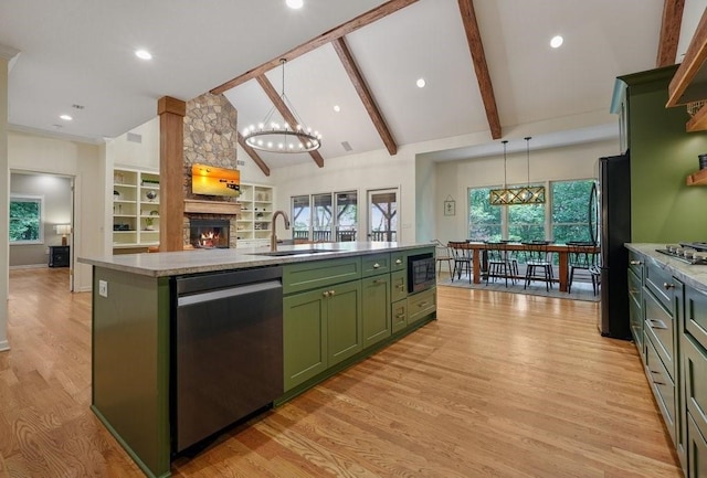 159 Cinnamon Fern Ln, Big Canoe, GA 30143 - kitchen with green cabinets, black appliances, a sink, a chandelier, and a fireplace