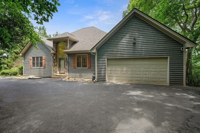159 Cinnamon Fern Ln, Big Canoe, GA 30143 - view of front of property with a garage and asphalt driveway