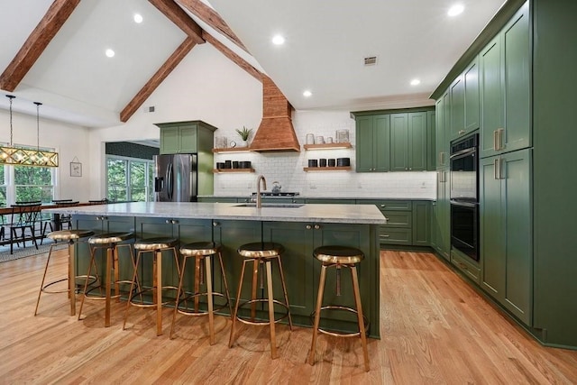 159 Cinnamon Fern Ln, Big Canoe, GA 30143 - kitchen with green cabinetry, stainless steel fridge with ice dispenser, a sink, light wood-type flooring, and a breakfast bar