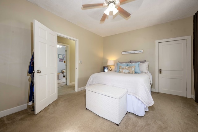 bedroom with baseboards, ceiling fan, and light carpet