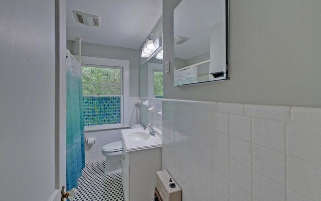 30 Proctor St, Murphy, NC 28906 - full bathroom with tile walls, vanity, a wainscoted wall, curtained shower, and heating unit