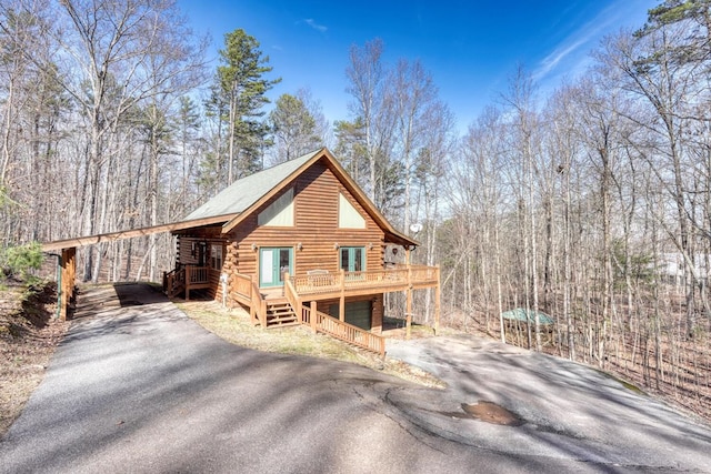 exterior space with a deck and a garage