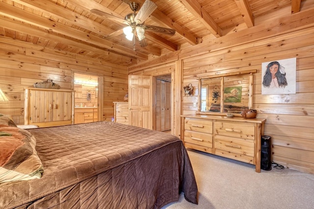 carpeted bedroom with wood ceiling, wooden walls, and beam ceiling