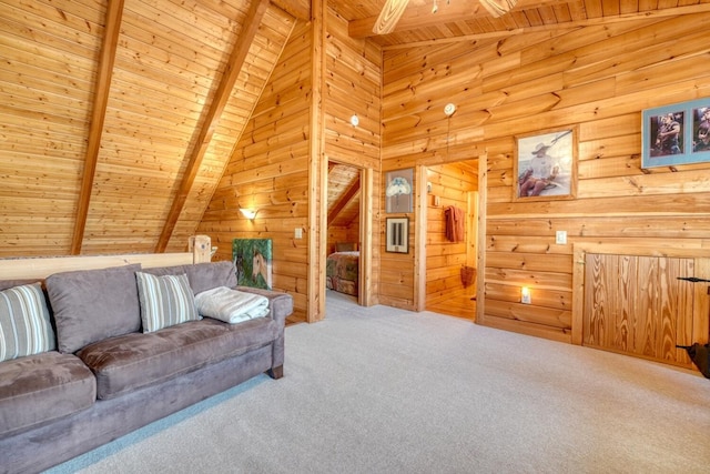 living room featuring vaulted ceiling with beams, carpet, wood walls, and wooden ceiling